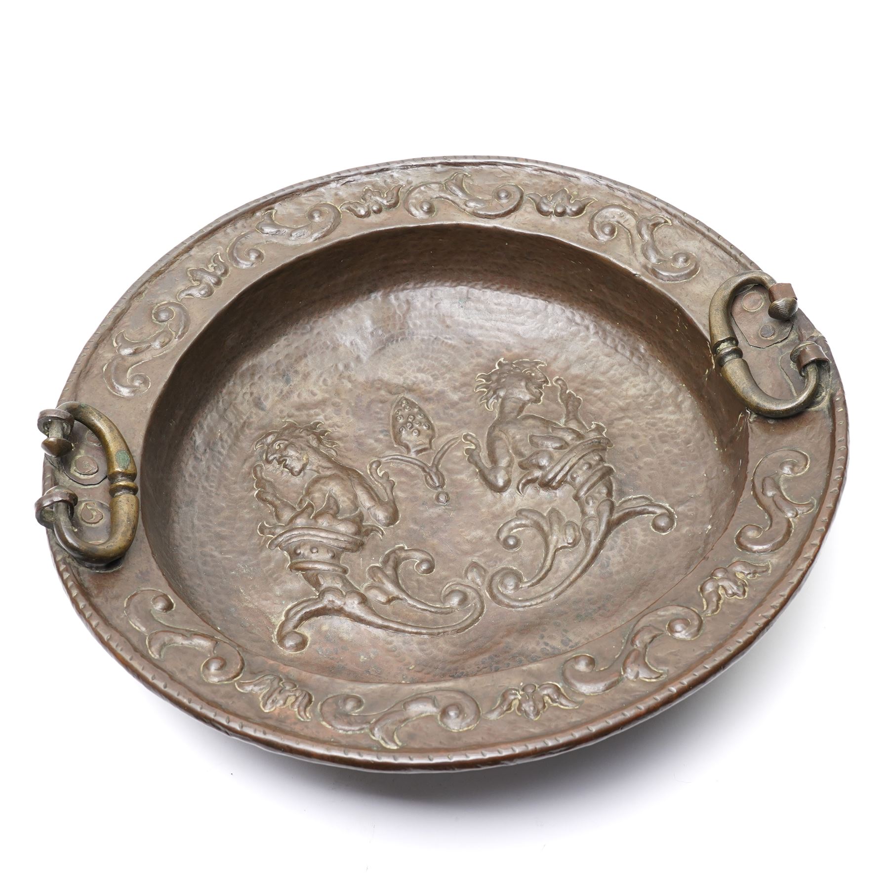 18th century Venetian copper two handled brazier, the base embossed with figures emerging from a cornucopia and a bishop's mitre, the border with embossed scrolls etc D50cm