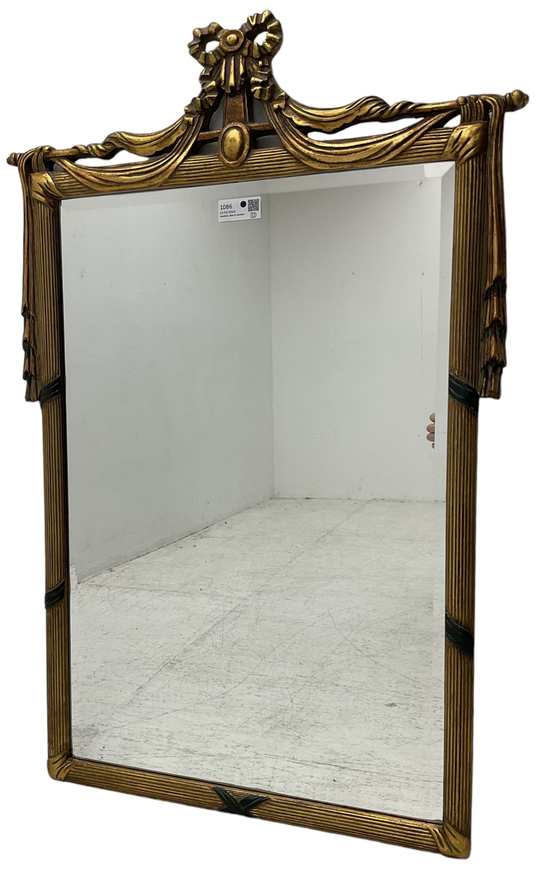 Regency design gilt framed wall mirror, ribbon pediment over hanging linen swags, bevelled mirror plate enclosed by reed moulded frame 