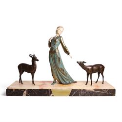 Art Deco painted spelter figure group, a lady and two deer, upon a rectangular marble base...
