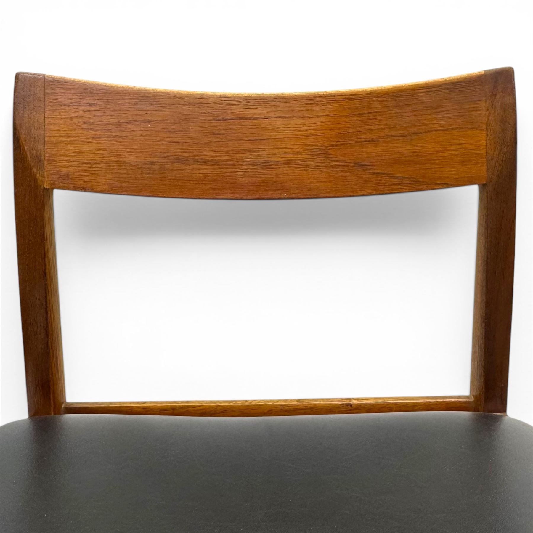 BCM (Bath Cabinet Makers) - mid-20th century teak extending dining table with BCM set of four teak dining chairs with bar back and black vinyl seats