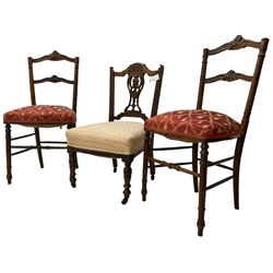 Pair of late 19th century walnut bedroom chairs, scrolled cresting rail carved with foliage, upholstered seats, on turned supports united by turned stretchers (W44cm); late Victorian bedroom chair with carved and pierced splat (3)