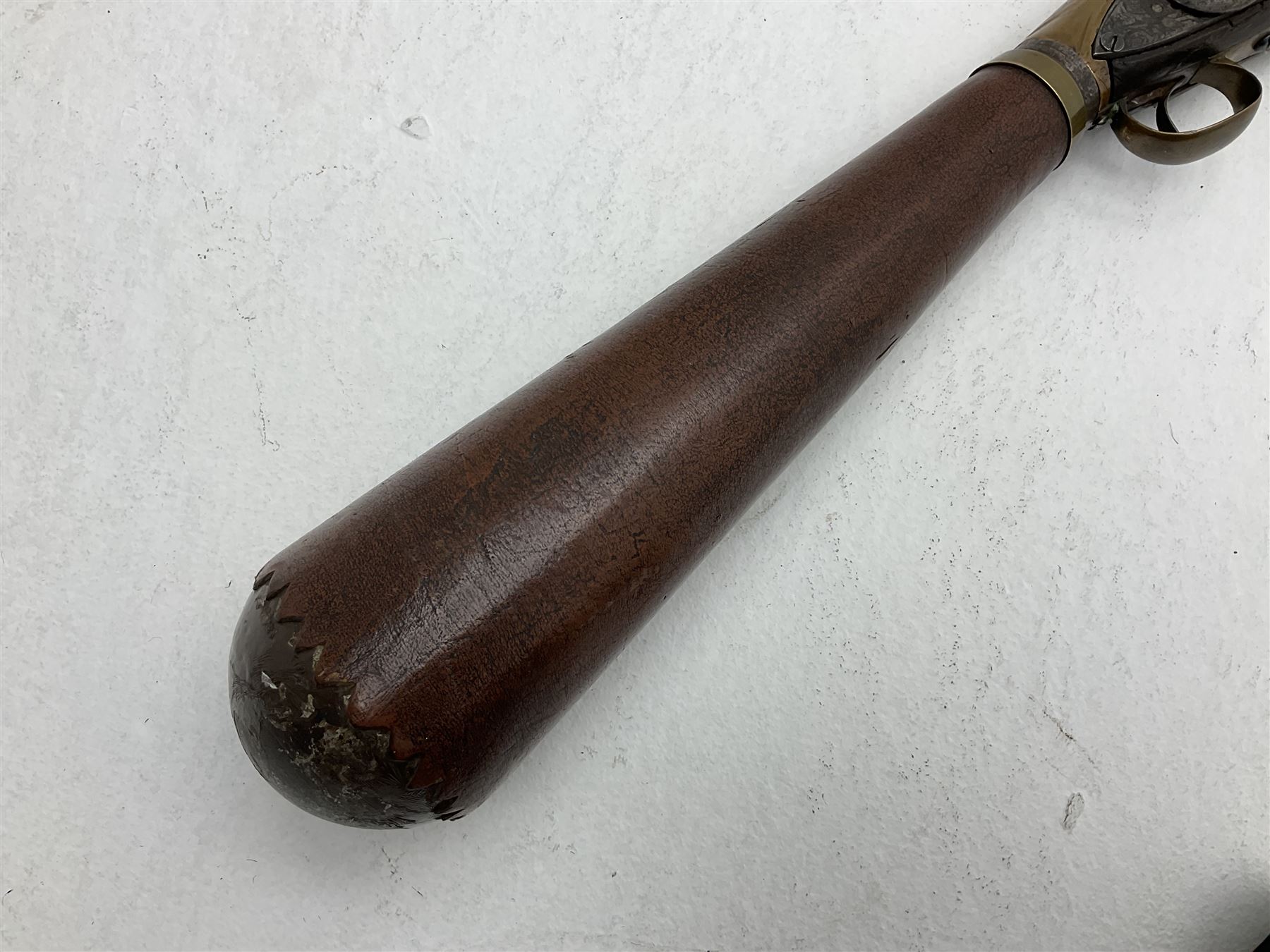 Late 18th century 7.2mm (approx. .28 calibre) Girandoni system single shot reservoir air rifle, the 62cm steel barrel with swivelling two-leaf rear sight, brass breech decorated with a sunburst and lever opening top loading, engraved steel lock-plates marked 'S. Gaskell' to the right side underneath the cocking lever, brass trigger guard,  leather covered steel butt reservoir of tapering conical form with brass ferrule and walnut fore-stock with horn mounts L107cm overall