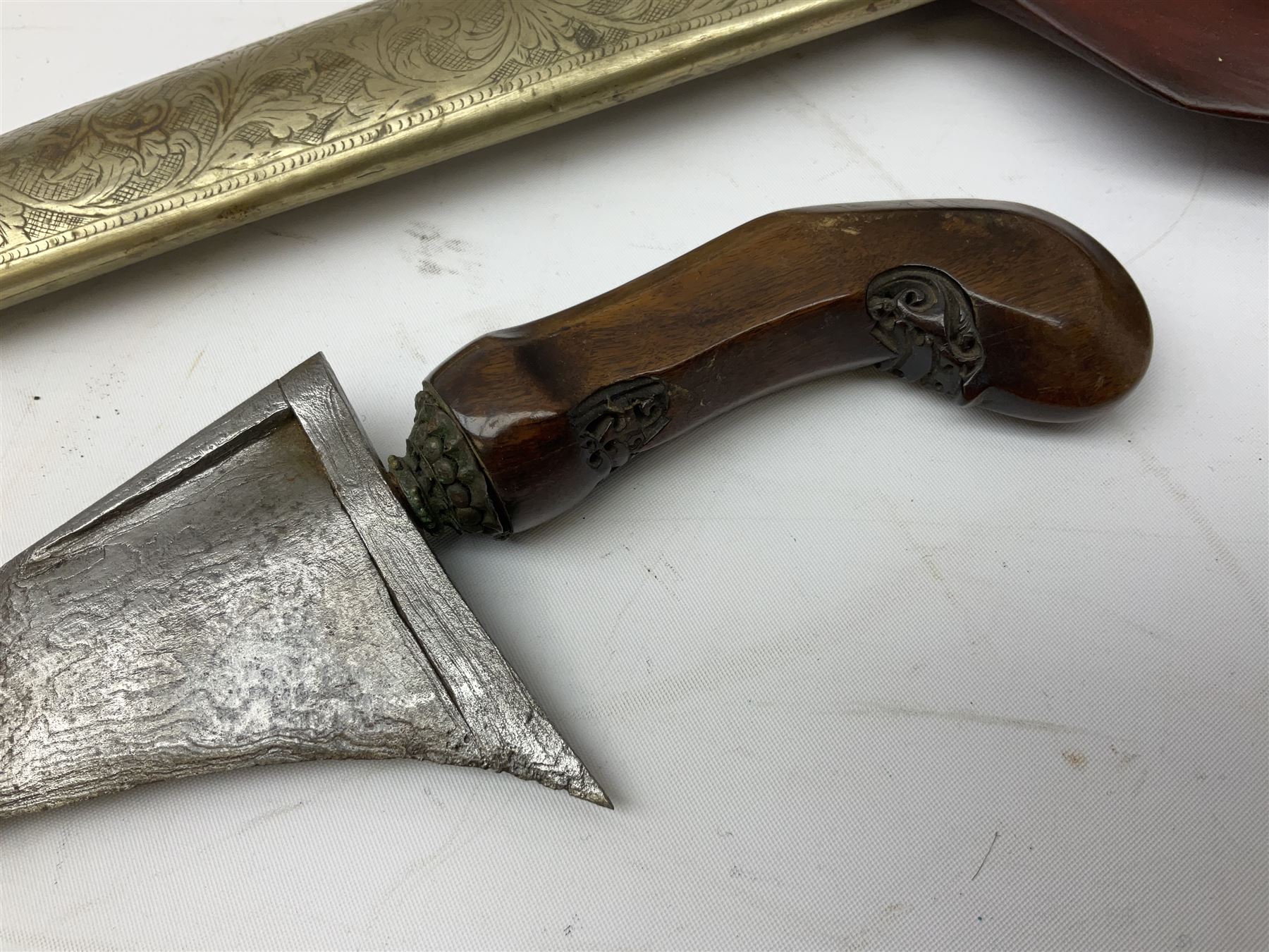 Malayan Kris dagger, the 31.5cm double edged straight heavy damascus blade with copper ferrule; carved hardwood grip; in large wooden throated scabbard with floral decorated white metal covering L47.5cm overall; a kris blade with adapted antler grip; and five various small daggers/letter openers (7)