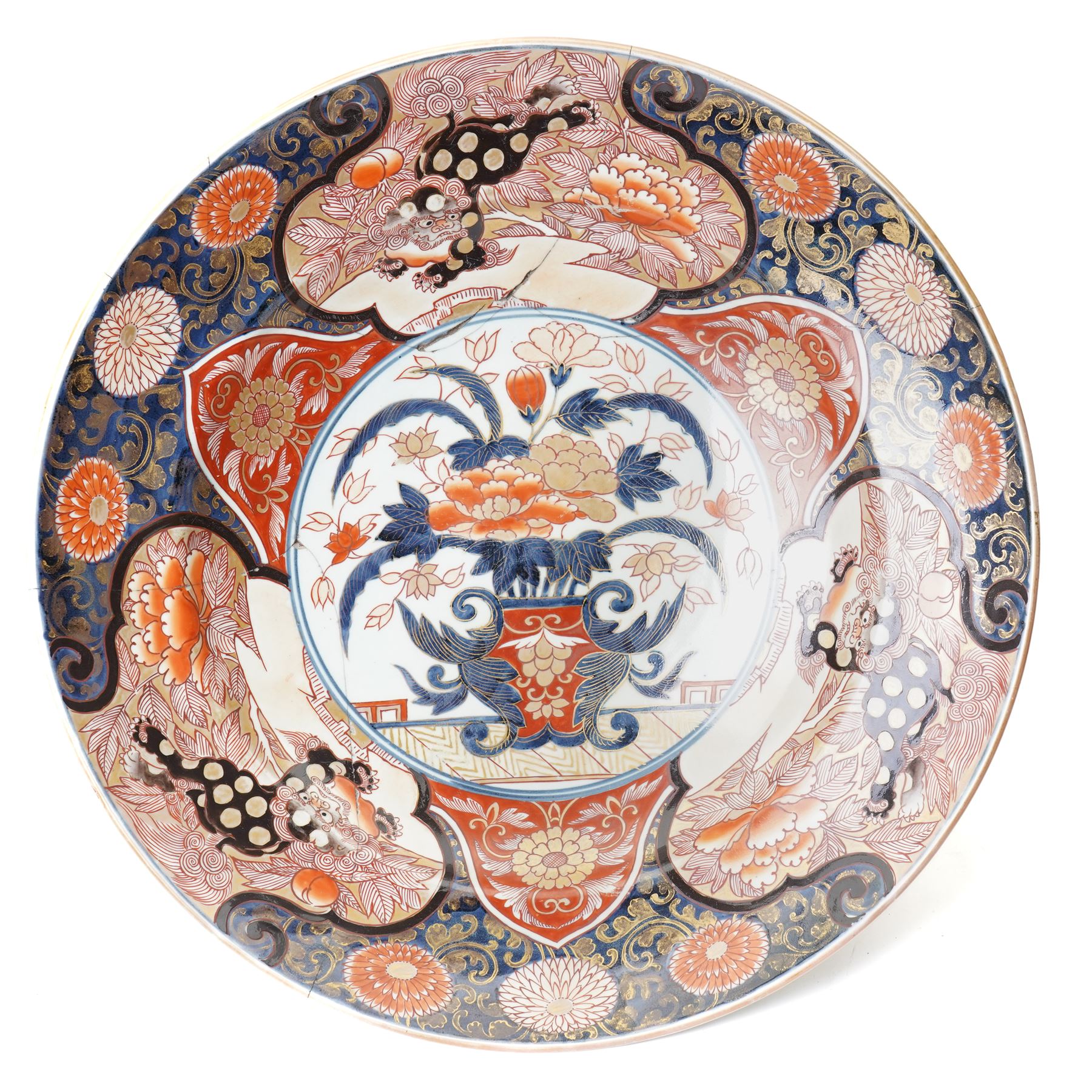 Japanese 18th century Edo period Imari porcelain charger, painted with a central peony in vase within a border of kiku and spotted shi-shi, D54cm 