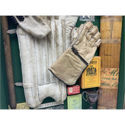 Four framed sporting memorabilia displays, the largest example containing 1930s cricket memorabilia, together with two fishing displays and a football display, each within wooden glazed frames, largest H105cm