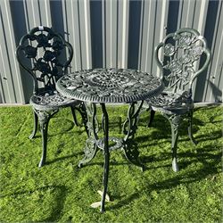 Cast aluminium  garden table and two chairs painted in green  - THIS LOT IS TO BE COLLECTED BY APPOINTMENT FROM DUGGLEBY STORAGE, GREAT HILL, EASTFIELD, SCARBOROUGH, YO11 3TX
