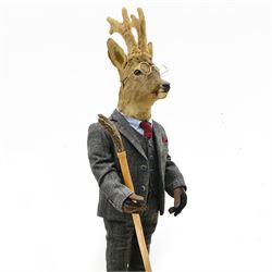Anthropomorphic Taxidermy: Roe Deer (Capreolus capreolus), in a standing pose dressed as a gentleman with suit and waistcoat, leather shoes and horn handled thumbstick, H112cm