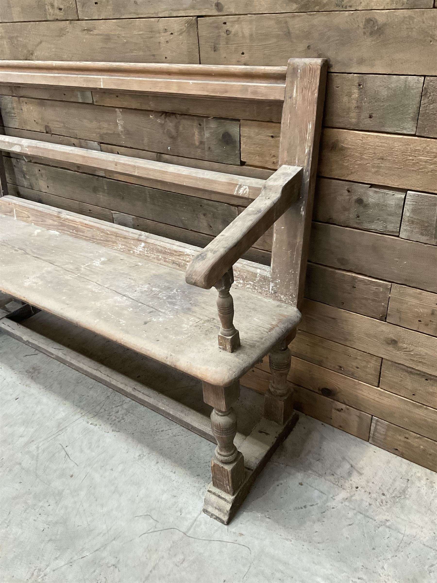 Victorian pitch pine bench pew, turned arms and legs, rail back with plank seat, 249cm