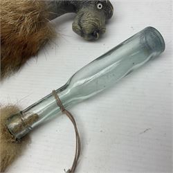 Fox brush with a handle modeled as a dog and another with glass vessel attached 