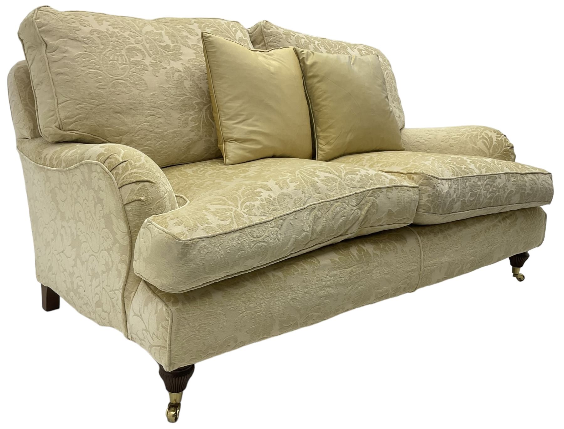 Multi-York - Howard shape two-seat sofa, upholstered in scrolling floral pattern loose covers, rolled arms, on turned front feet with brass cups and castors