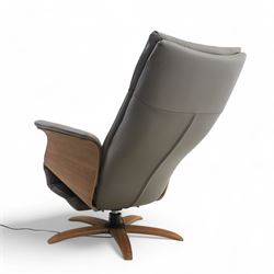 Hjort Knudsen - Danish electric reclining and swivel armchair upholstered in pewter leather, raised on a plywood frame above a five point base