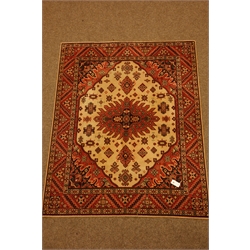  Gold and ivory ground Kilim rug, geometric design with Greek key border (140cm x 202cm), peach ground Tekke Bokhara rug, two red ground Persian design rugs and two green ground rugs  
