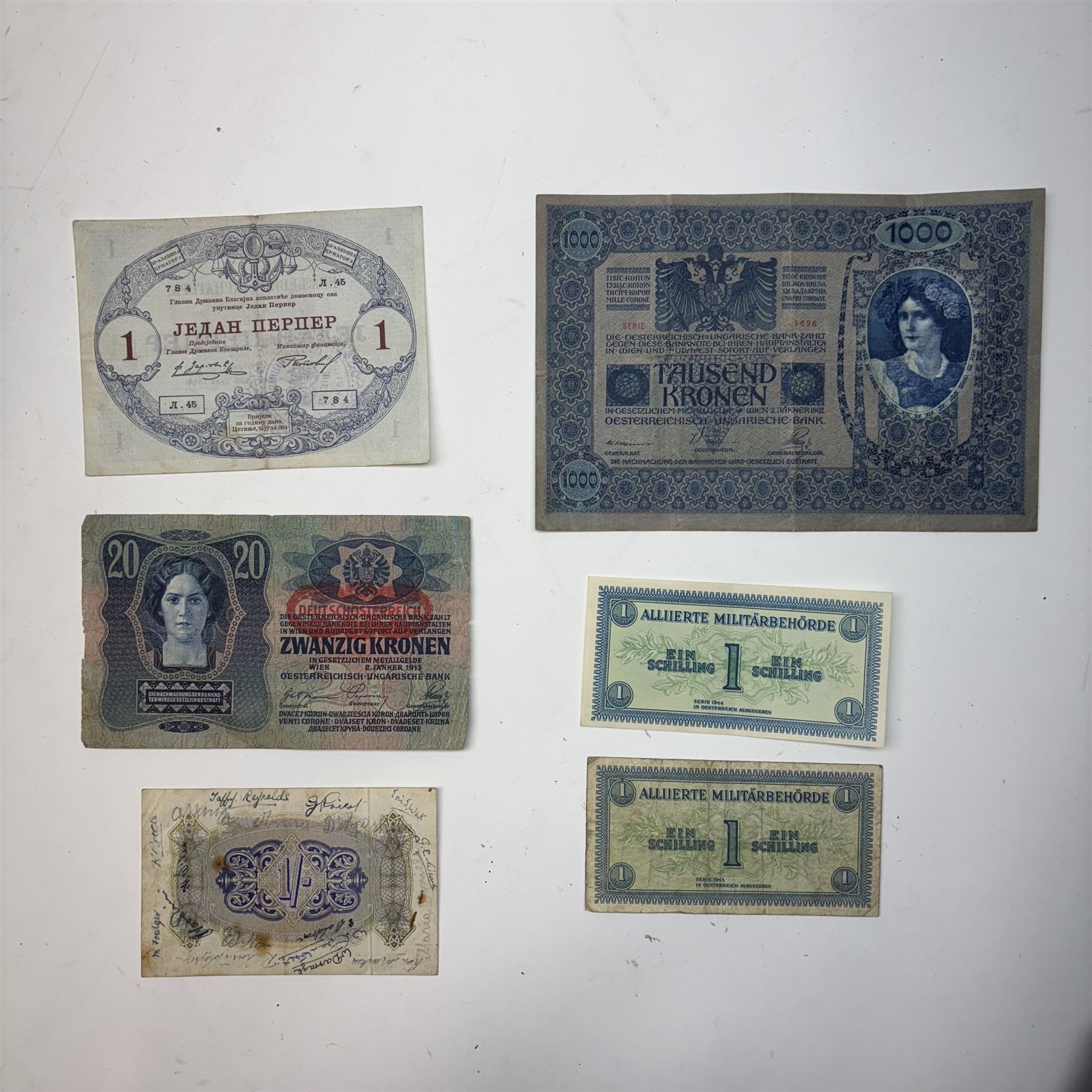 WWI two pairs of medals together with The Soldiers Small Book of Thomas Adams, Kings Message to the RAF, and other military ephemera and a soldiers helmet  