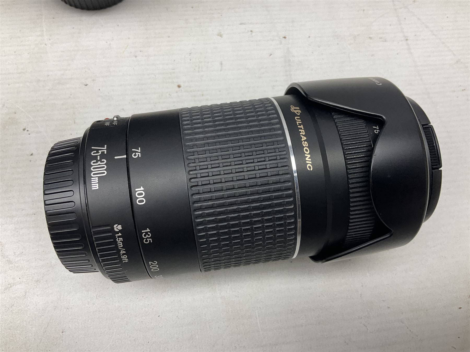 Canon Eos 7D camera body, serial number 3261306344, with 'Canon Ultrasonic EF 24-105mm Macro 0.45m/1.5ft Ultrasonic' Lens, 'Canon Zoom EF 75-300, 1;4-5.6 III' lens and Teleplus Pro 300 lens, together with tripod and original camera box 