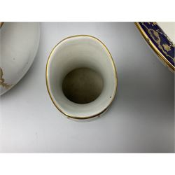 Early 20th century Bishop and Stonier four piece toilet set, comprising washbowl, wash jug, toothbrush pot, and chamber pot, each  decorated with deep blue band and husk swags and festoons in gilt, with printed Caduceus Bisto marks beneath and printed retailers mark 'Manufactured for Harrods Limited London', wash bowl D43cm, wash jug H31.5cm