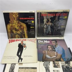 Sixteen James Bond books, including Live and Let Die, The Spy who Loved Me, Four Your Eyes Only, Moonraker etc, together with various 007 ephemera, soundtrack vinyls etc 