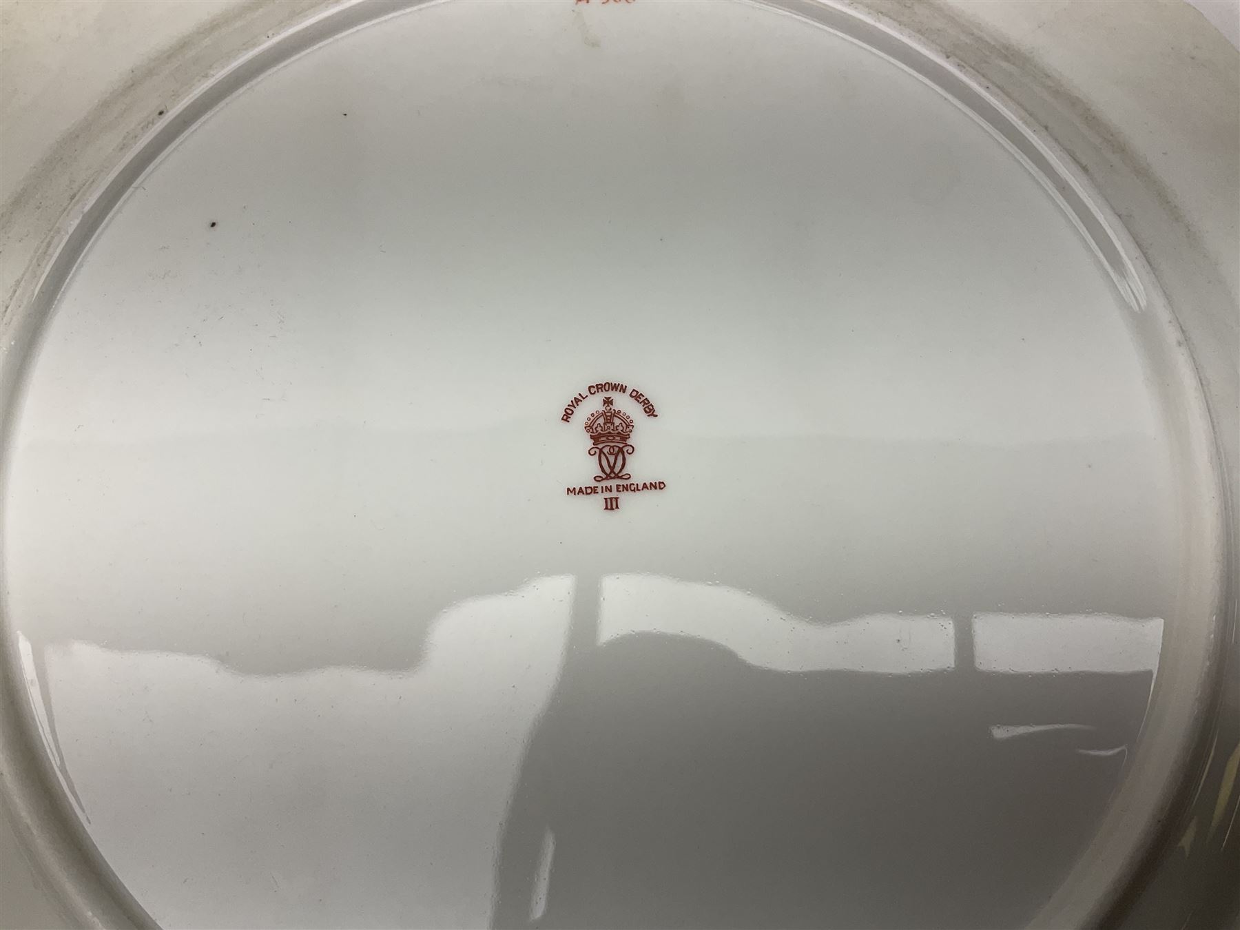 Royal Doulton toby jug of Winston Churchill H23cm and large character jug of Falstaff; together with four collector's plates by Royal Crown Derby, Royal Worcester and Limoges (6)