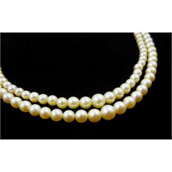 Double strand pearl necklace, graduating pearls between 3mm and 7.5mm, on 18ct white gold old cut diamond and opal milgrain set clasp, boxed