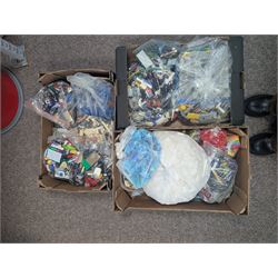 Large collection of loose Lego, including minifigures, together with three Lego ideas books, in five boxes