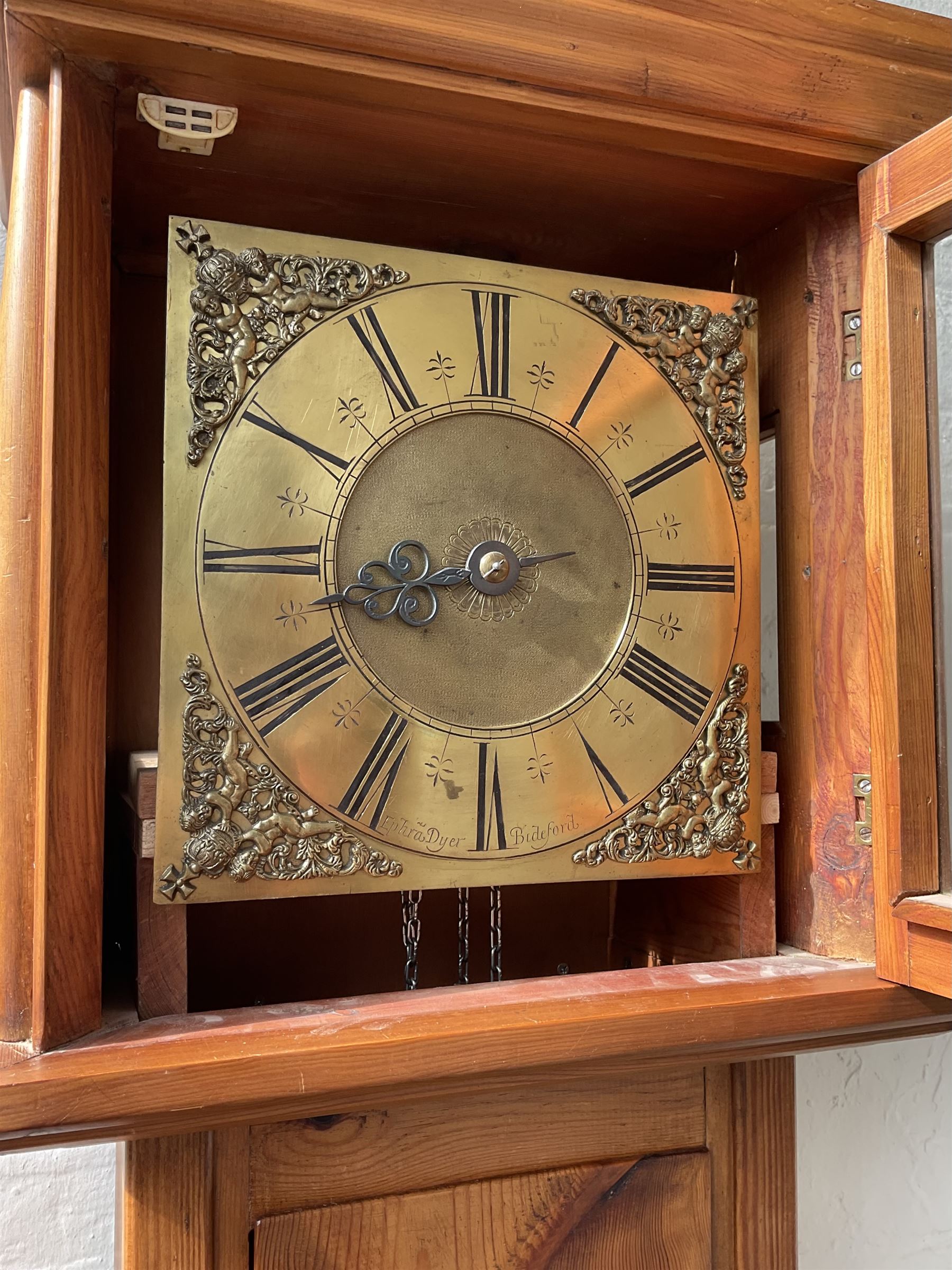 Contemporary Pine longcase clock -  With an early single handed 18th century 30hr movement and dial, movement and dial by Ephraim Dyer of Bideford, 1683-1723, brass dial with a matted dial centre, cast spandrels, single steel hand and chapter ring with Roman numerals, dial pinned to a chain driven birdcage movement with a countwheel strike, striking the hours on a bell. No weight or pendulum.