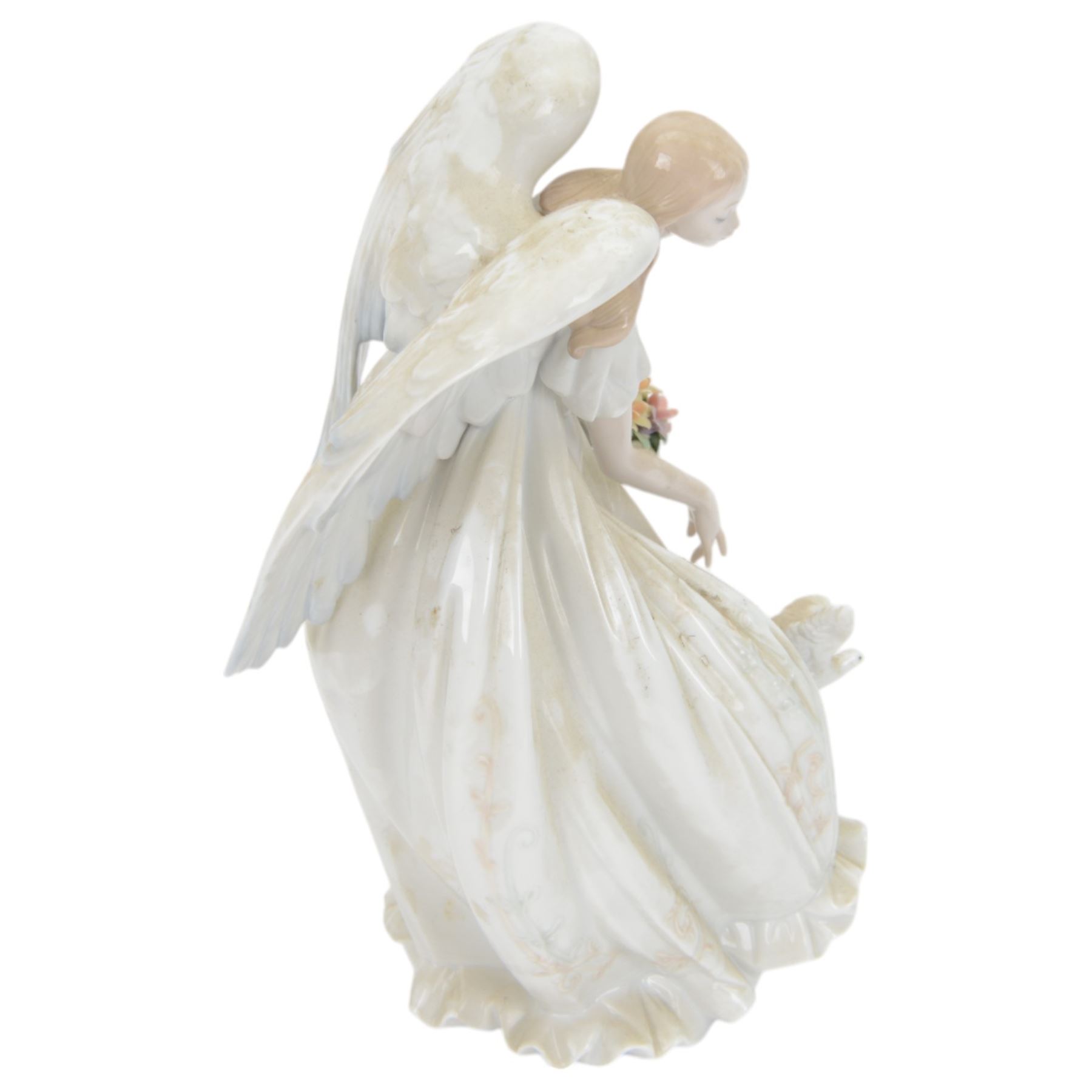 Lladro figure Flowers of Peace, modelled as an angel holding flowers, no 1867, H33cm