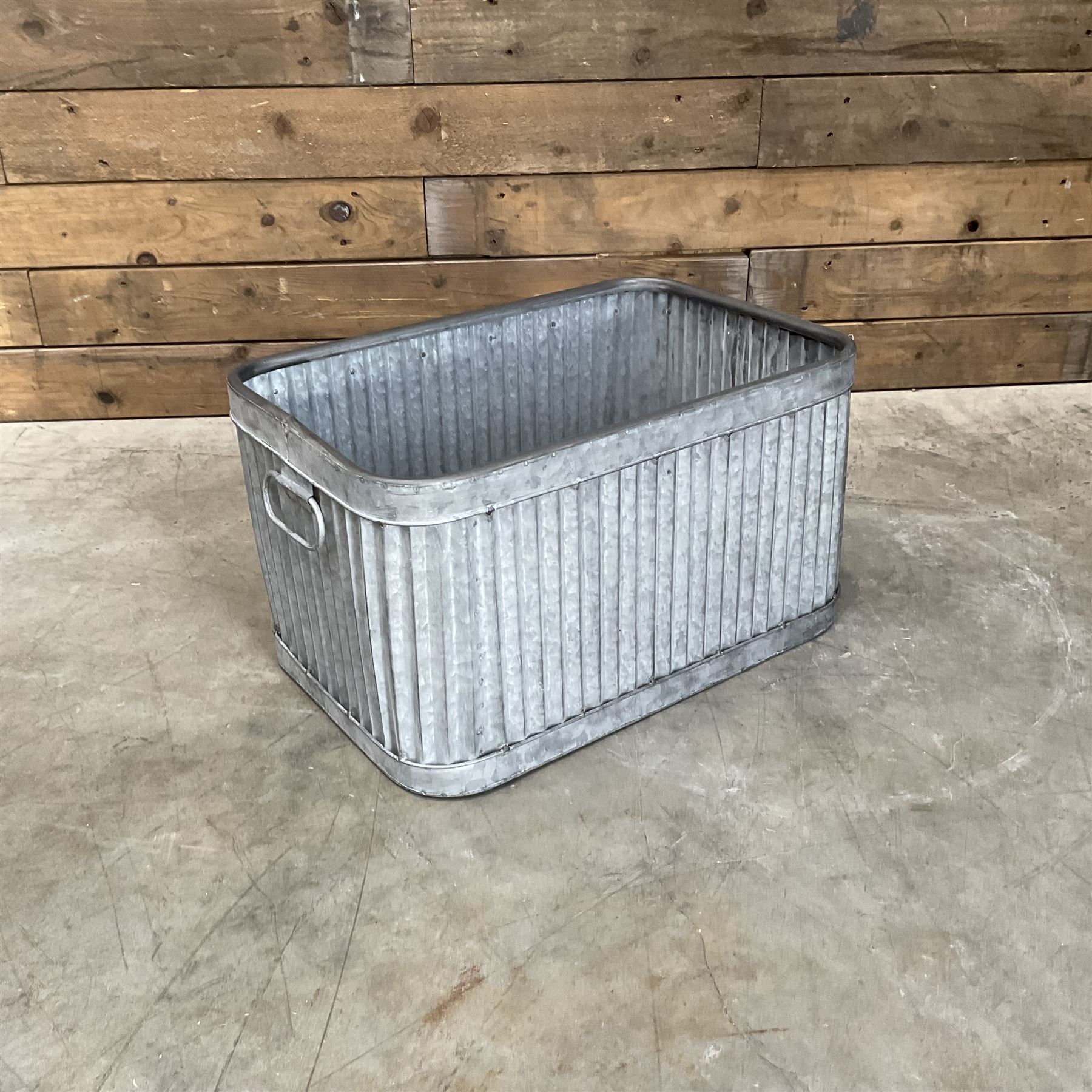 Set of three pressed metal planters in different sizes