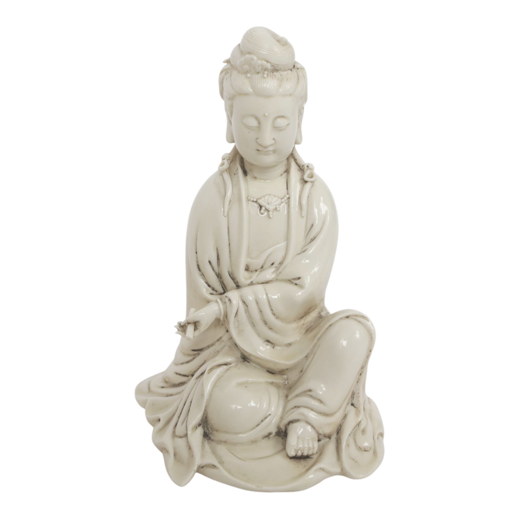 Three Chinese blanc de chine, each depicting Guanyin seated, Dehua province, two with double gourd and potters seal marks to the reverse 