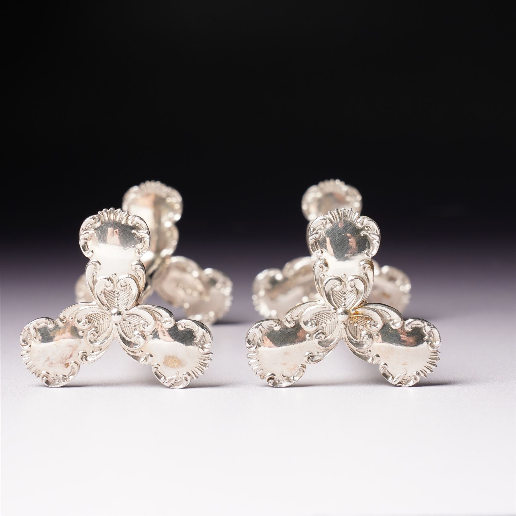 Pair of late Victorian silver knife rests with scroll moulded decoration Sheffield 1898 Maker Lee & Wigfull in original leather box for A & J Thompson, Scarborough 