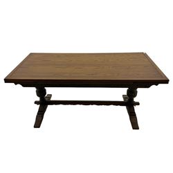 Old Charm oak drawer leaf dining table, bulbous supports, stretcher base, and six chairs with upholstered seats