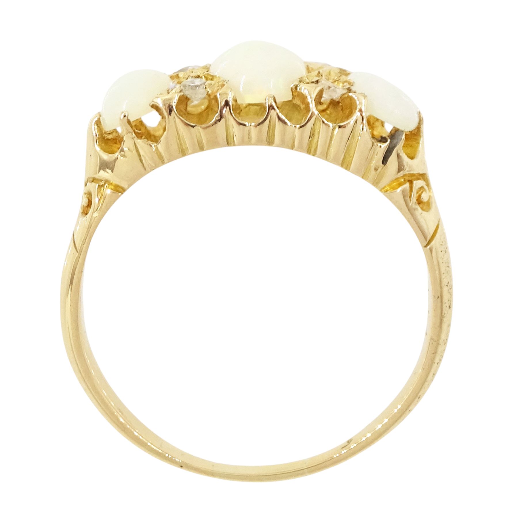 Early 20th century 18ct gold opal and diamond ring, three graduated oval cut opals, spaced by four accent diamonds