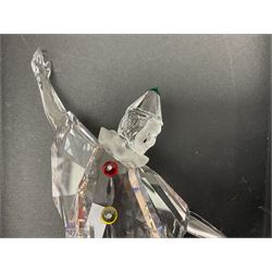 Swarovski Crystal Masquerade trilogy; 1999 Masquerade Pierrot, 2000 Columbine, 2001 Harlequin all with accompanying plaque, stand and original box, together with a glass display case with mirrored back and sides 