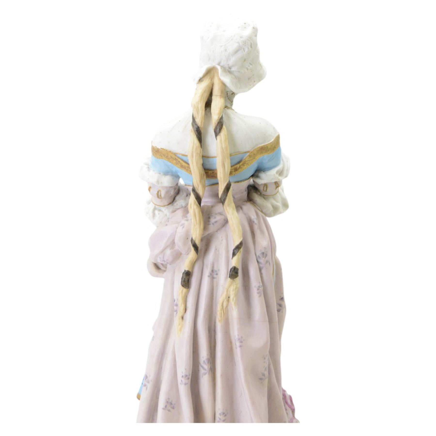Large late 19th century French bisque figure, in the manner of Jean Gille, modelled as a female figure in high neck floral gown and bonnet, upon a naturalistically detailed circular base, overall H65.5m