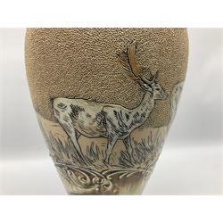 Late 19th century Doulton Lambeth sgraffito vase decorated by Hannah Barlow, of baluster form with waisted neck and flared rim, decorated with a central sgraffito band of deer between scrolling borders, against a mottled brown glazed ground, with impressed and incised marks beneath including monogram, H46cm