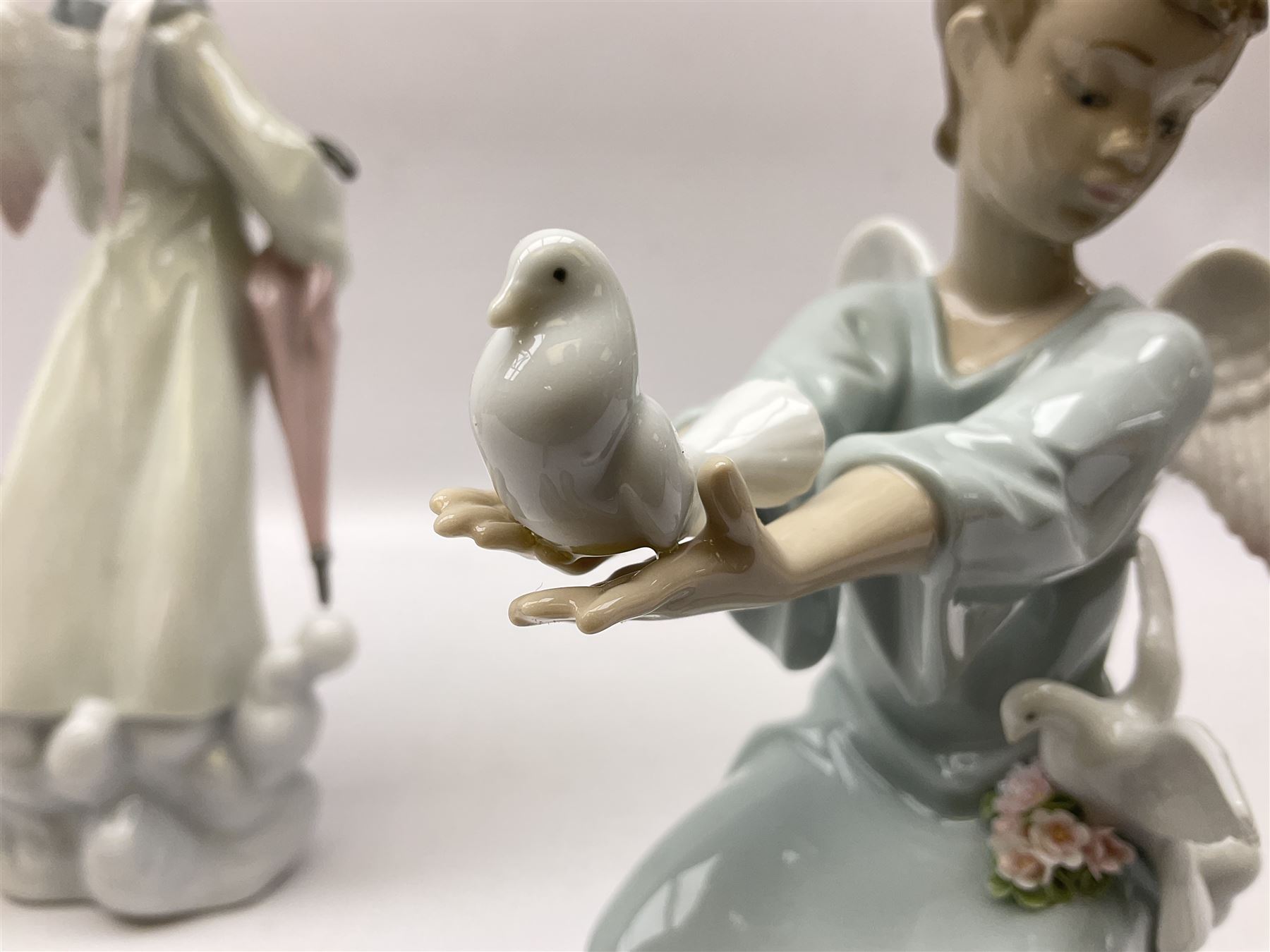 Lladro Season Angels set, comprising Spring Angel no 6146, Fall Angel no 6147, Summer Angel no 6148 and Winter Angel no 6149, all with original boxes, largest example 29cm