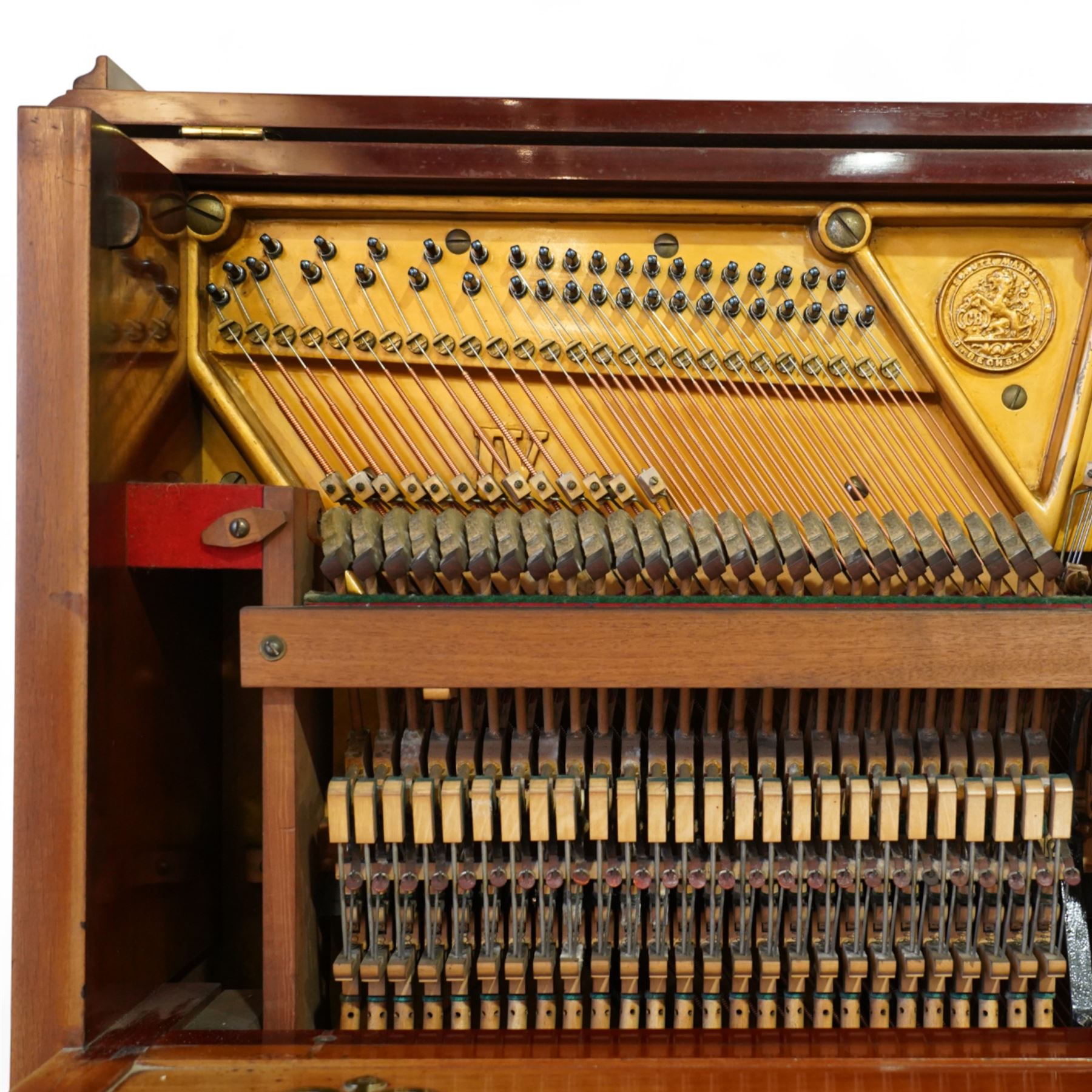 Claud Bechstein- German model IV overstrung upright piano in a mahogany Arts & Crafts designed case by Walter Cave, Serial number 56589 (1900-01), with a lattice music desk and silk backed open fretwork, square key fall with makers name and crafted brass hinges, two candle sconces on tapered square supports, makers name and model number cast into the frame, with an underdamper action, una-corda and sustain pedals, recently re-strung with new tuning pins, responsive action and damping, in very good playing condition, with 85 ivory and ebony keys A0-A7, tuning A=440. Including a period duet stool with a velvet-padded top.
Walter Cave was a leading architect, interior designer, and furniture maker during the Arts & Crafts period, a similar piano to this was owned and played by George Bernard Shaw and is on exhibition at the National Trust property, Shaw's Corner (Hertfordshire).

This item has been registered for sale under section 10 of the APHA Ivory Act, Reference 8P3C9UKA
