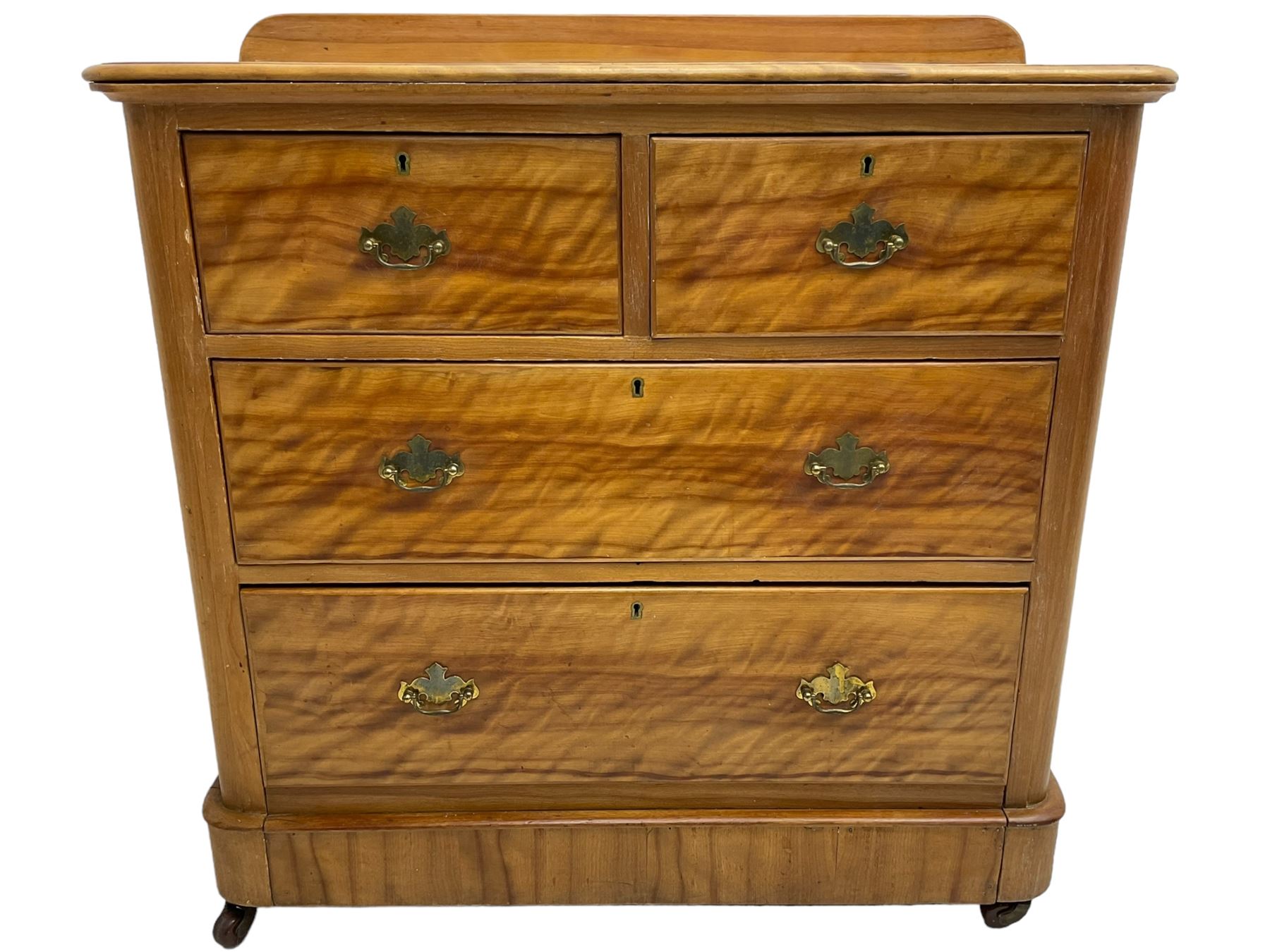 Victorian satin walnut chest, raised back over two short and two long drawers, skirted base with castors