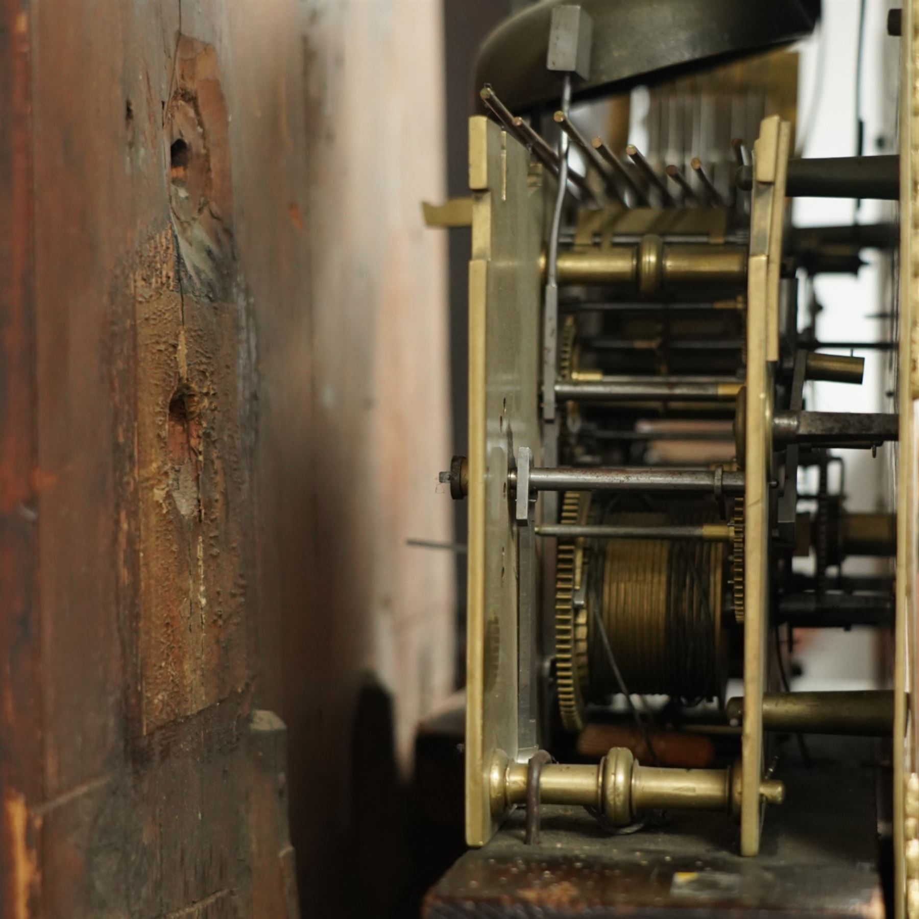 Lister of Halifax -  Oak cased musical longcase clock c1790, 8-day movement sounding the quarters and hours on bells or gong rods, case with a flat pediment and oval  conch inlay beneath, break arch hood door with reeded pilasters and brass Corinthian capitals, trunk with conforming quarter recessed pillars and a long wavy topped door, plinth with a raised panel and applied moulding the the base, break arch brass dial with cast spandrels and engraved dial centre, with a silvered chapter, seconds dial and cartouche with makers name, gongs or bells selector to the arch, chapter with Roman numerals, five minute Arabic's, minute track and steel moon hands, dial pinned directly to a three train weight driven movement with a nest of eight bells and eight gong rods, sounding the hours on either bells or gong rods, with a rack strike and recoil anchor escapement. With pendulum and weights.
The Lister family were a prodigious family of prolific clockmakers working in Halifax and the West Riding area of Yorkshire during the 18th and 19th century, well-known and noted for producing a number of chiming and musical longcase clocks.