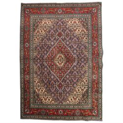 North West Persian Tabriz hand-knotted rug, ivory field with a central lozenge shaped meda...