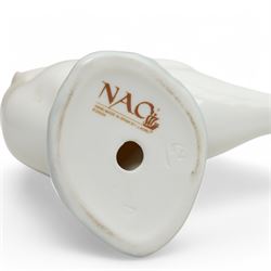A group of eight Nao figures, together with one Lladro Polar Bear figure, each with printed mark beneath (9)