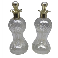  Pair Victorian silver mounted decanters of pinched waisted form by Henry Matthews, Birmingham 1894 with later white metal stoppers, H28cm   