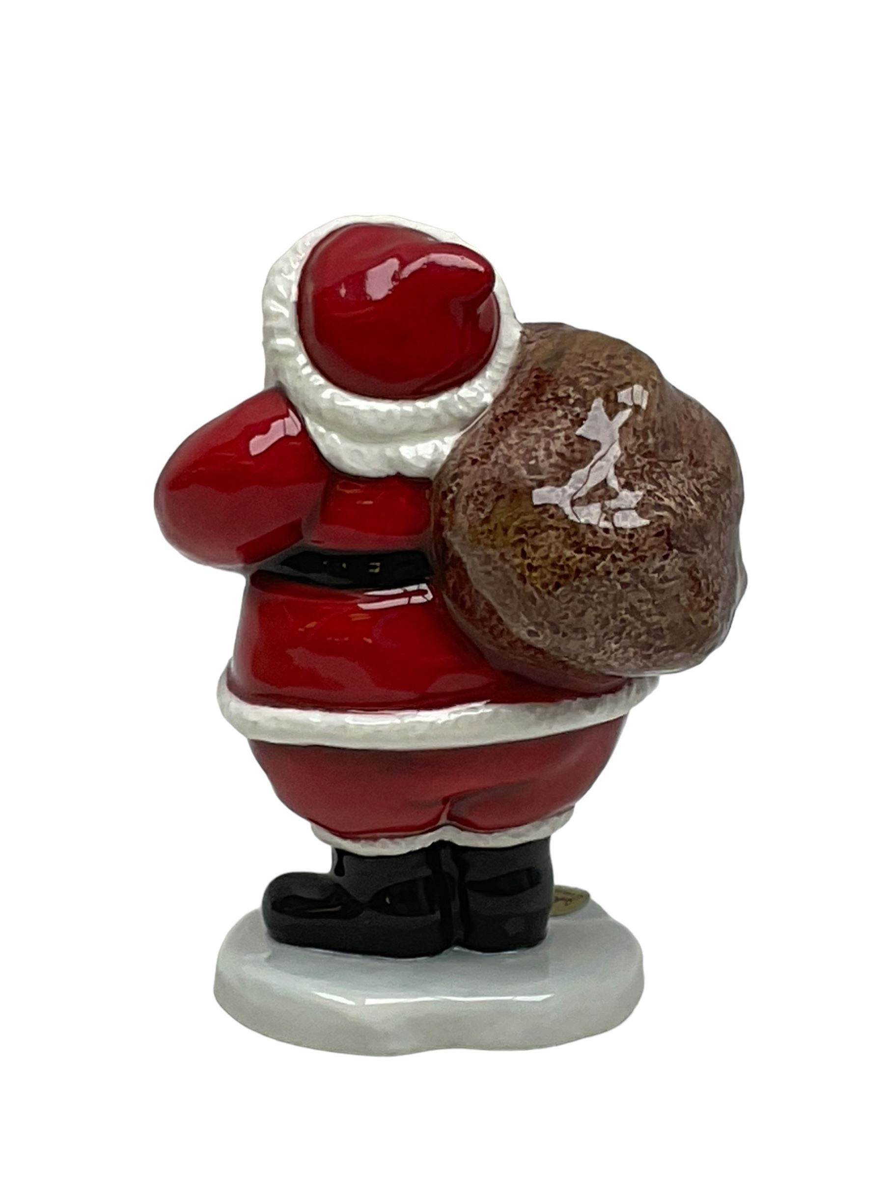 Two Beswick figures, composing The Snowman and Father Christmas, together with Border Fine Arts Enamel dish depicting a scene from The Snowman A3995, all in original boxes 