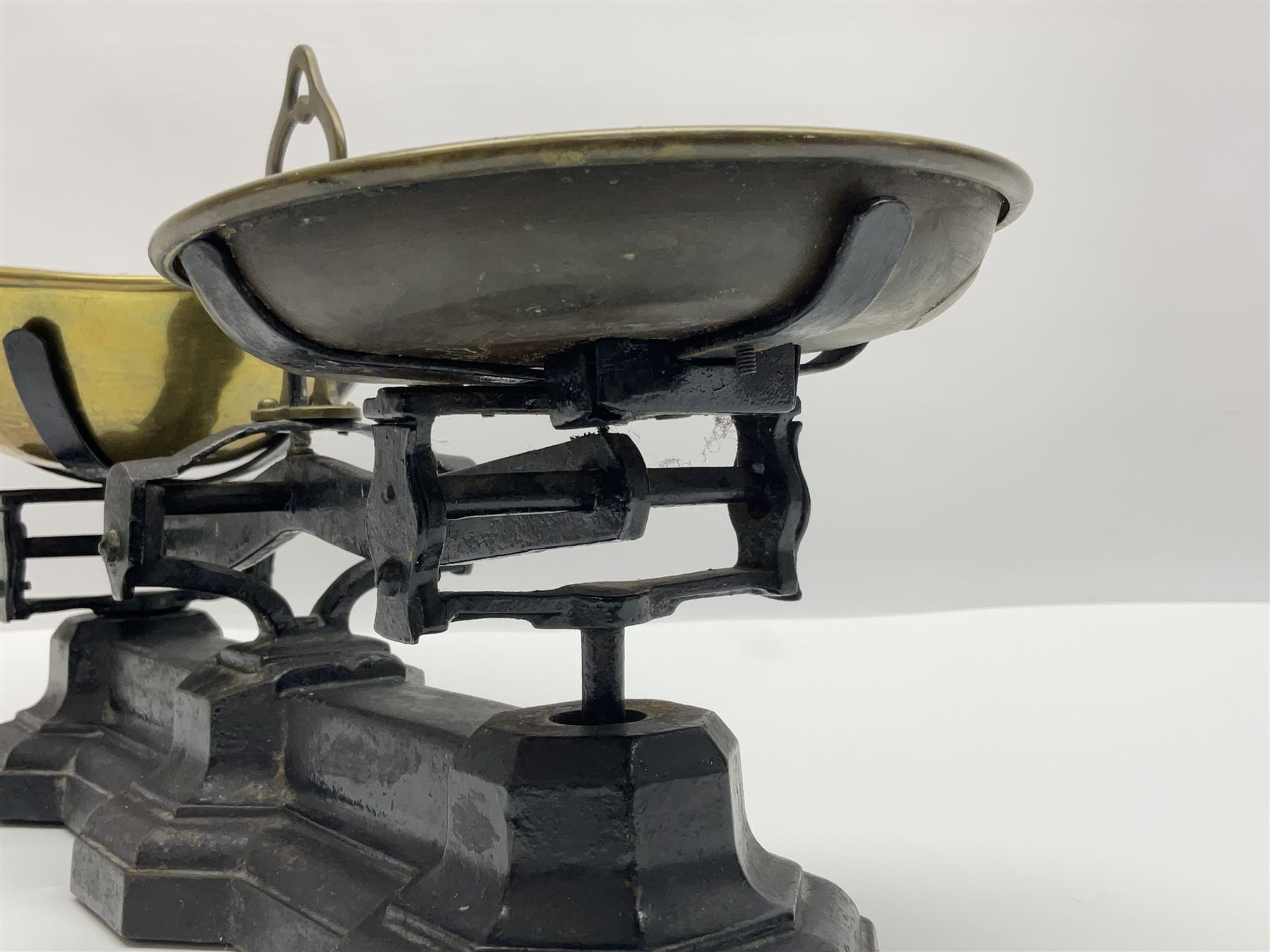 Black painted and brass kitchen balance scales with graduated set of brass weights