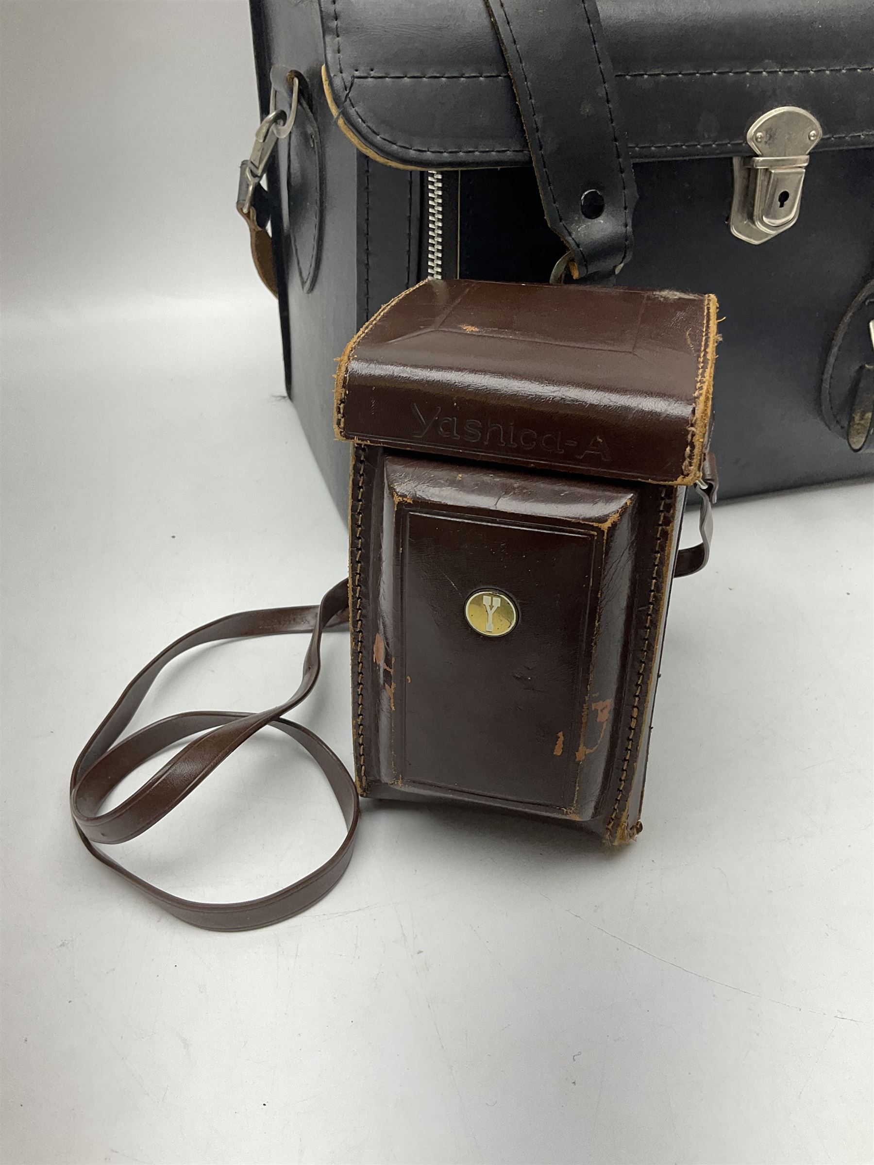 Yashica-A camera body, serial no. A4080073, with 'Yashikor 1:3.5 f=80mm' lens, serial no. 209272 and 'Yashikor 1:3.5f=80mm' lens, serial no 22942, together with Yashica TL-Electro camera body, serial no. 5054162 with 'Yashinon-DS 50mm 1:1.9  40056038