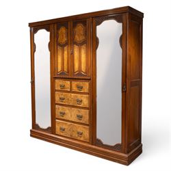 Edwardian figured walnut triple combination wardrobe, moulded cornice above a three part w...