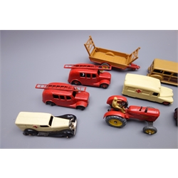  Dinky - eight unboxed and playworn early die-cast models including two fire engines each with ladder and bell, Massey Harris Tractor and Halesowen Farm Trailer, Daimler Ambulance and another ambulance, taxi with driver etc  