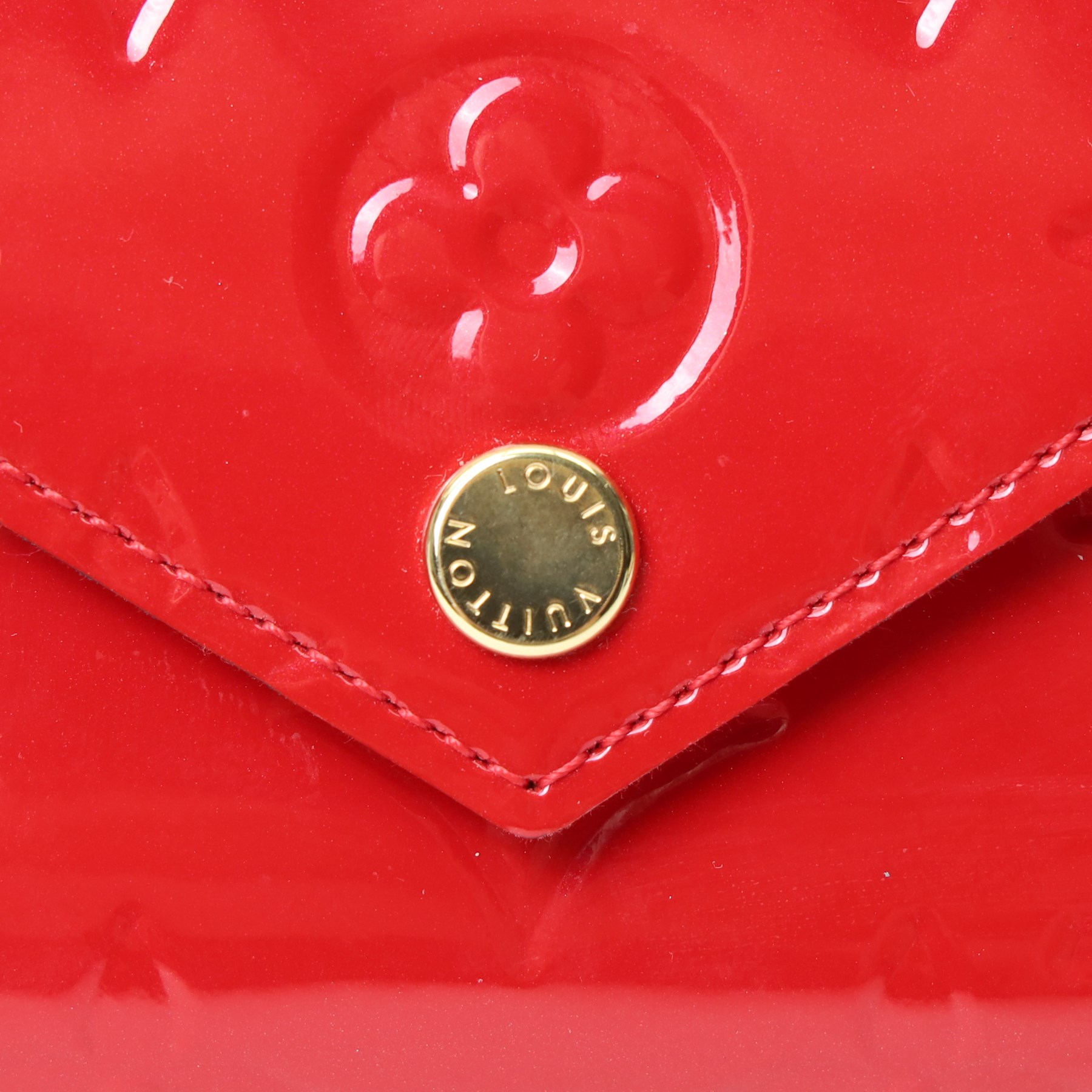 Louis Vuitton - ‘Lucy’ pochette in Cerise red Monogram Vernis leather, the structured envelope-form body with gold-tone press-stud fastening, opening to a red fabric-lined interior with central zipped compartment and two gusseted open pockets, with care card, dust bag and box