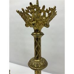 Pair of gilt metal pricket candlesticks, with applied decoration on knopt stems and triform bases, H47cm