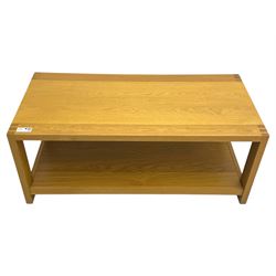 Light oak rectangular coffee table, with exposed finger joints to the corners, raised above a full-length undertier on straight supports
