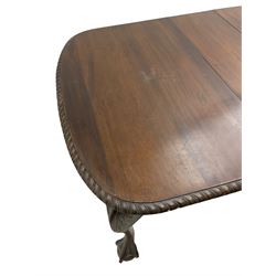 Early 20th century Georgian design mahogany extending dining table, rectangular top with rounded corners and gadrooned edge, moulded frieze rail over cabriole supports with acanthus carved knees and ball and claw feet, on castors, with additional leaf