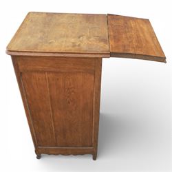 20th century French style oak bedside chest of pedestal form, the top with rounded moulded edge with drop leaf to the back, above five carved drawers with applied scroll ornament and turned knobs, the cupboard base with twin carved doors with diamond lattice panels, with shaped apron and bracket feet